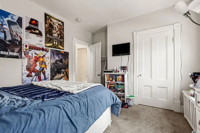 a bed room with a bed and a view of bedroom