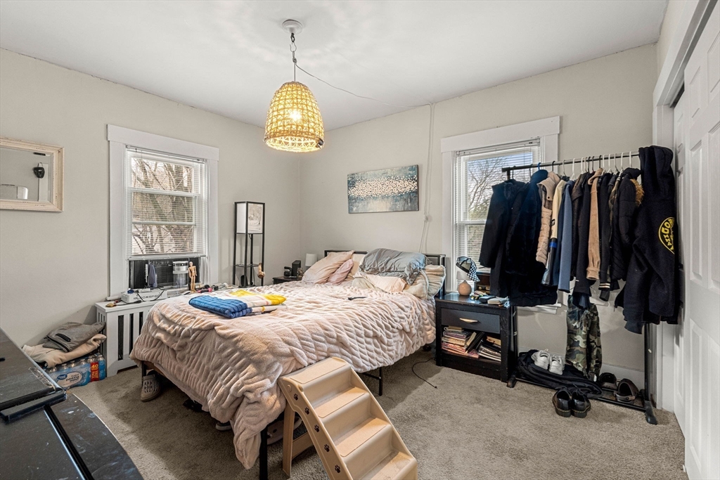 32 Kirby Street Marlborough, MA 01752 - Photo 20 of 39 a bedroom with a bed and a tv