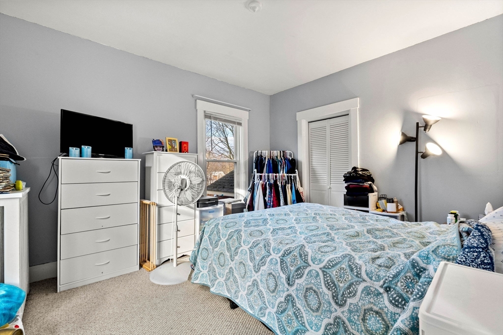 32 Kirby Street Marlborough, MA 01752 - Photo 21 of 39 a bedroom with a bed and a flat tv screen