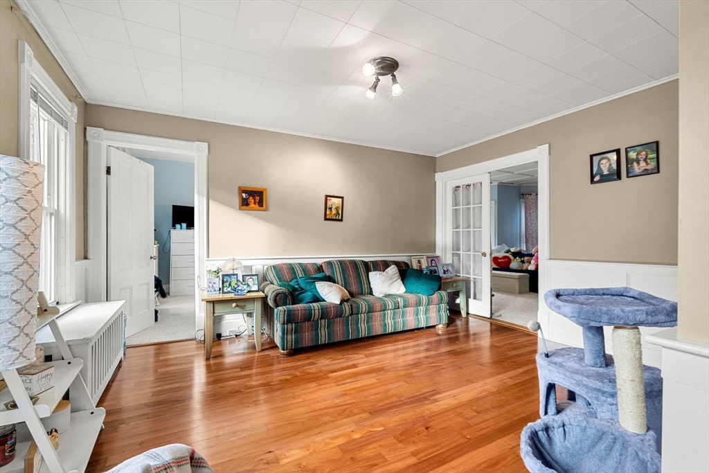 32 Kirby Street Marlborough, MA 01752 - Photo 24 of 39 a living room with furniture and a wooden floor