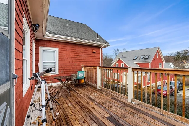a balcony view with a seating space