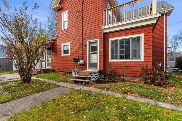 a front view of a house with garden