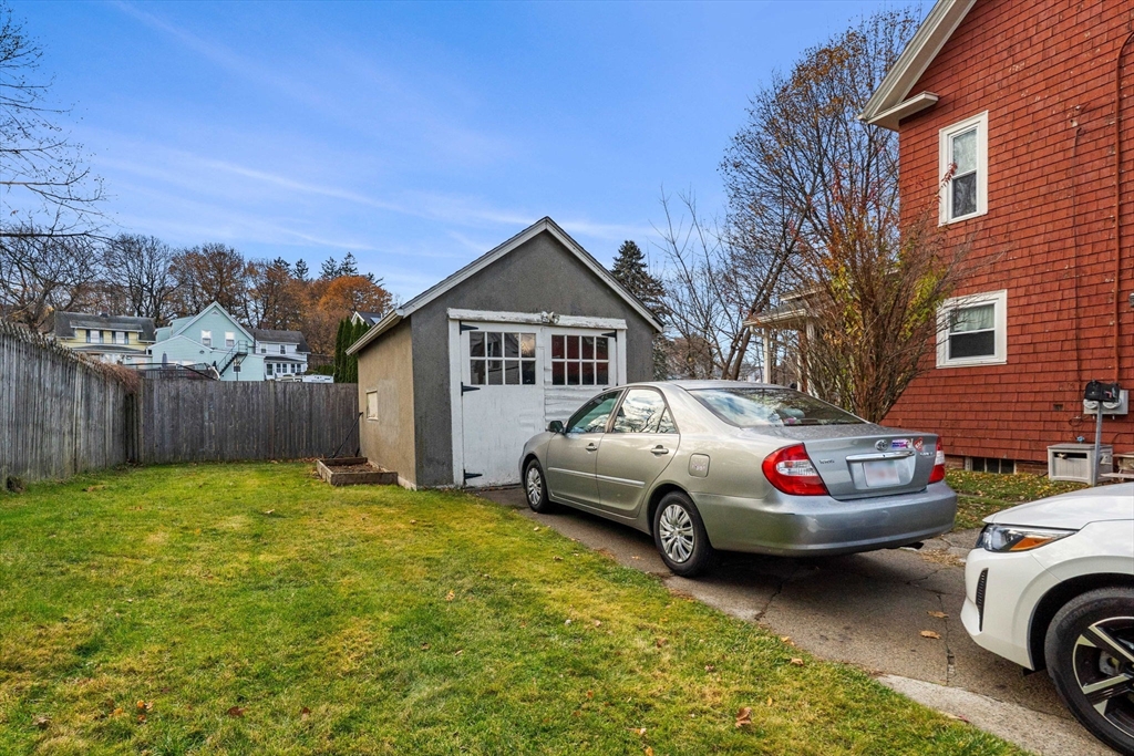 32 Kirby Street Marlborough, MA 01752 - Photo 37 of 39 a white house covered with tall trees