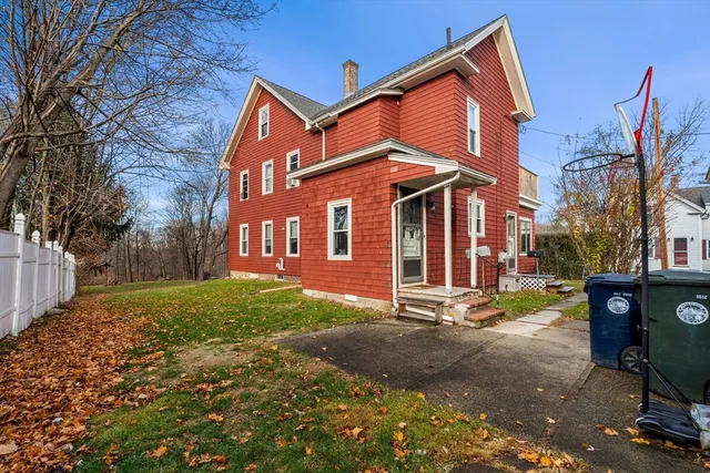 a view of a house with a yard