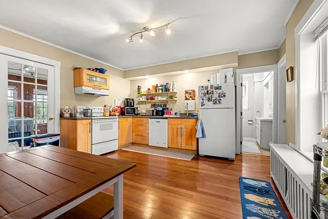 a living room with stainless steel appliances kitchen island granite countertop furniture and a kitchen view