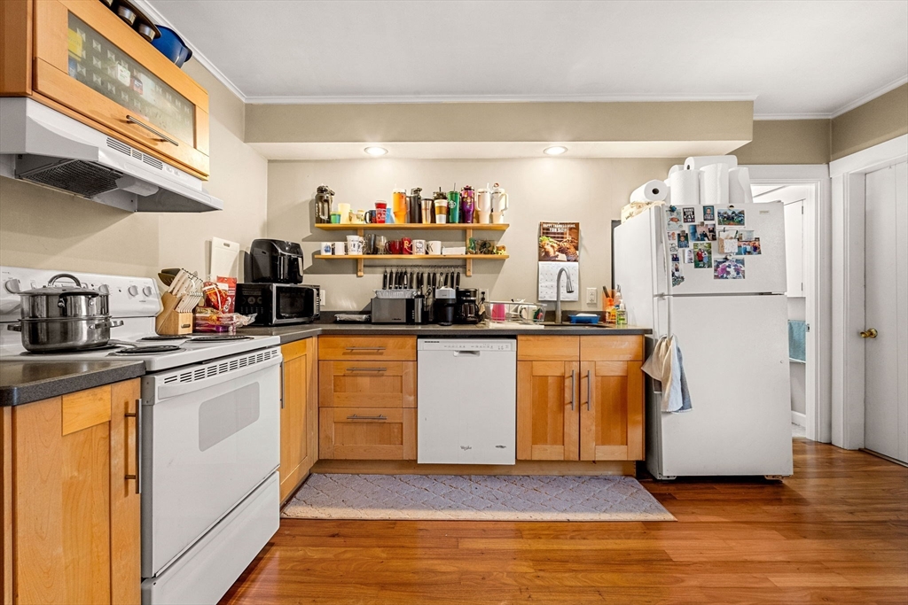32 Kirby Street Marlborough, MA 01752 - Photo 8 of 39 a kitchen with stainless steel appliances a refrigerator and white cabinets