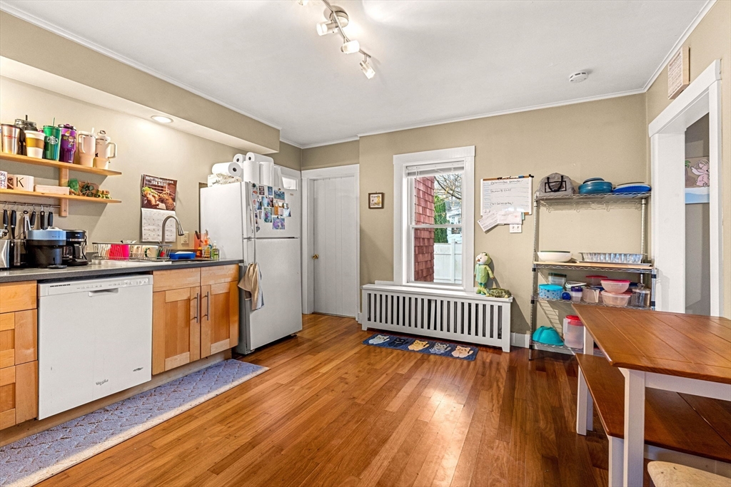 32 Kirby Street Marlborough, MA 01752 - Photo 9 of 39 a kitchen that has a lot of white cabinets and wooden floor