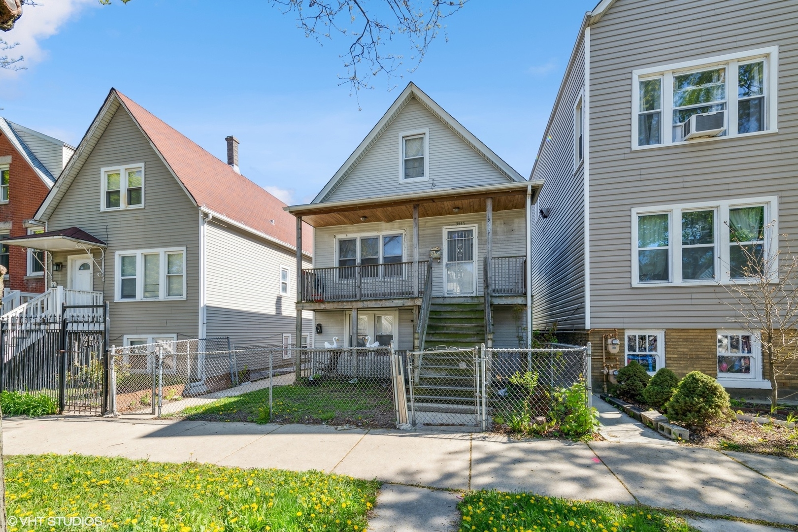 3447 West Melrose Street Chicago, IL 60618 - Photo 1 of 15 a front view of a house with a yard