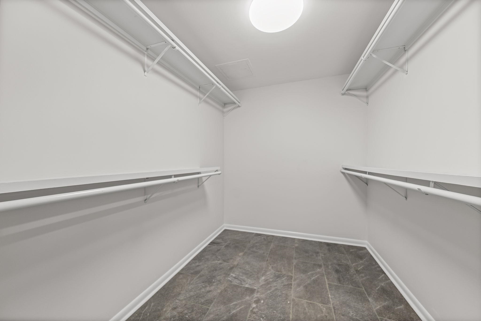 448 Tennessee Street Memphis, TN 38103 - Photo 20 of 39 Walk-in closet featuring grey tile flooring, white walls, and a ceiling-mounted light fixture