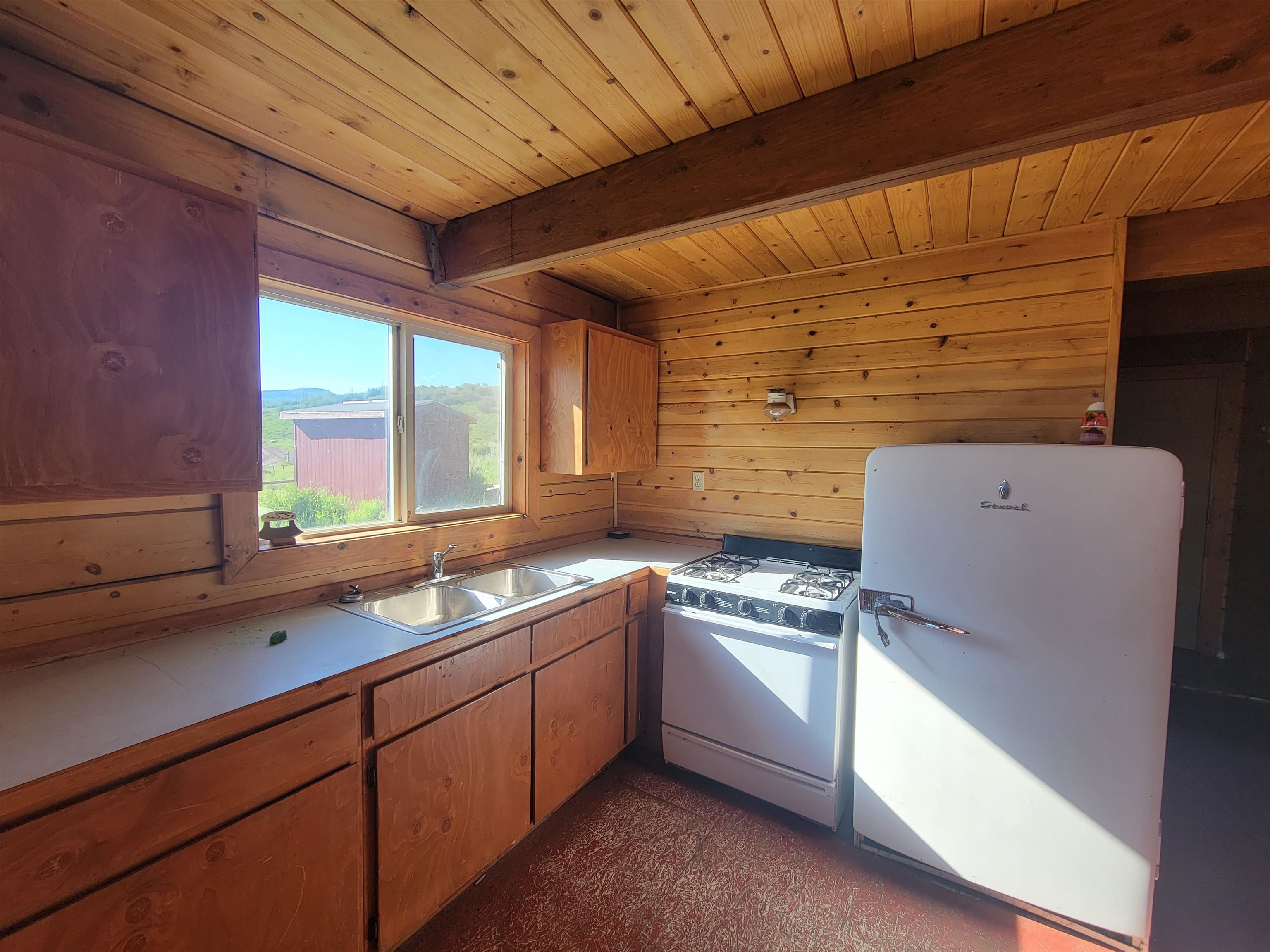 69855 E Highway Collbran, CO 81624 - Photo 30 of 41 a kitchen with cabinets appliances and a sink