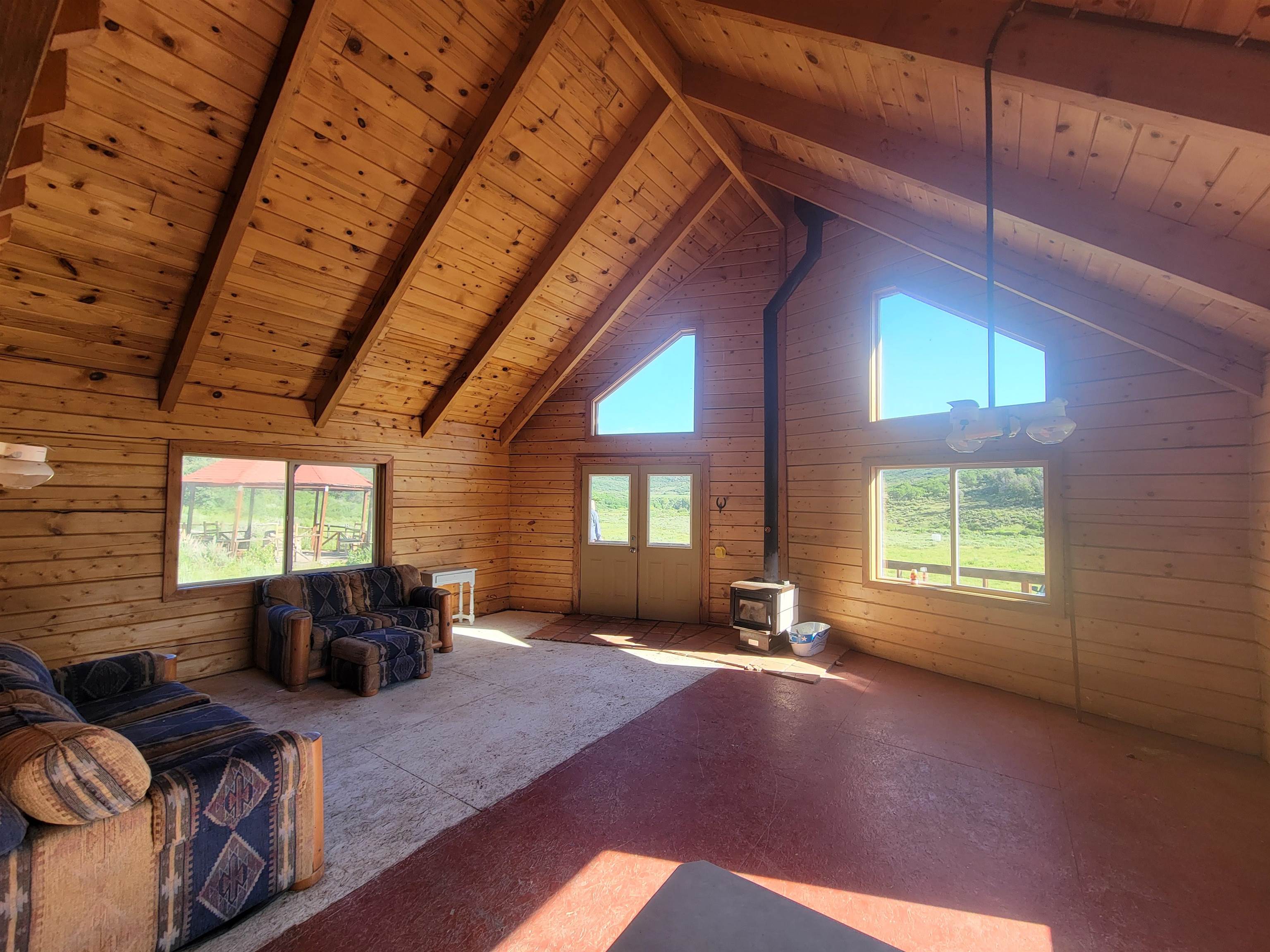 69855 E Highway Collbran, CO 81624 - Photo 33 of 41 a living room with furniture window and wooden floor
