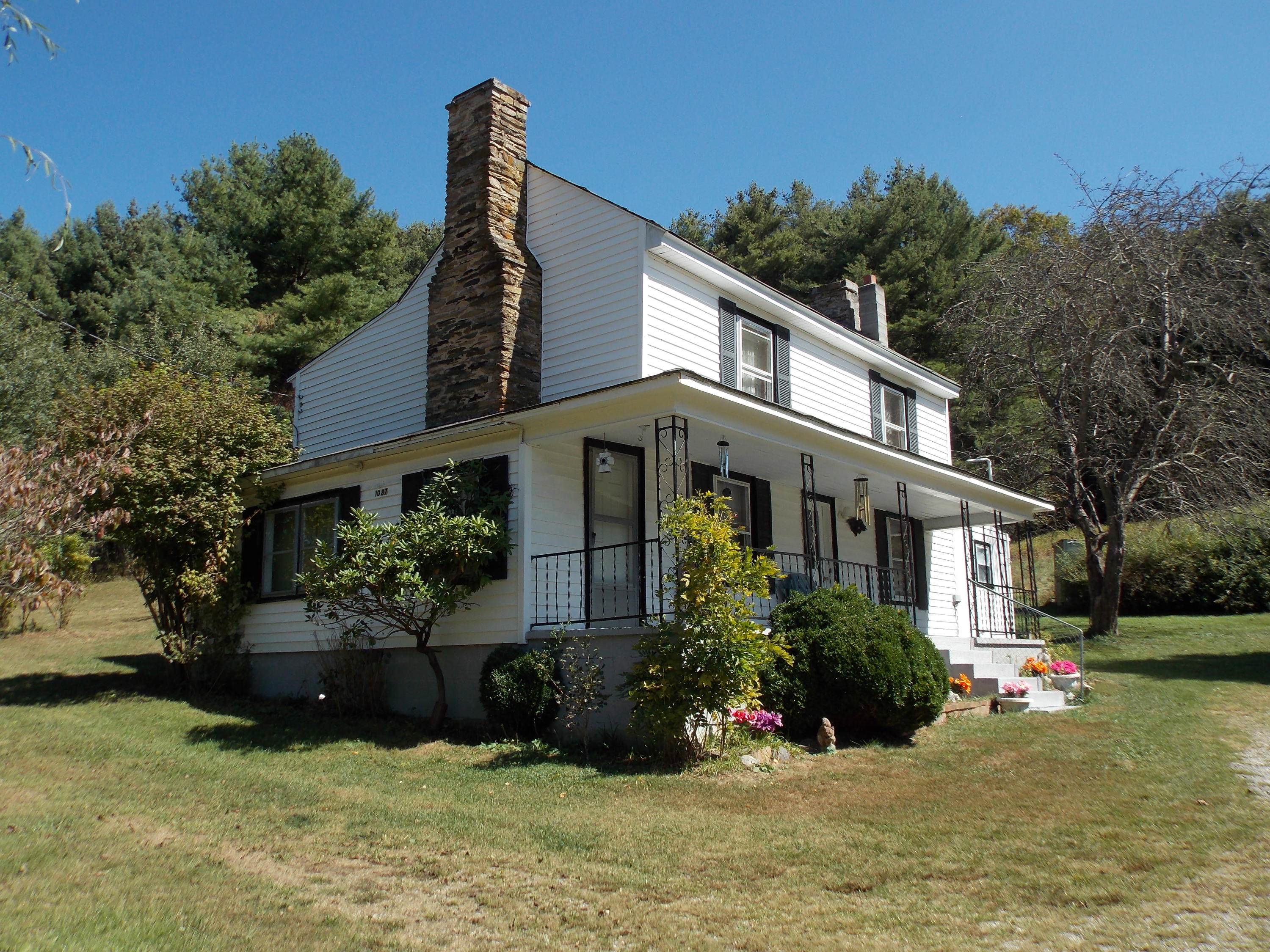 1087 Conner Grove Road Southwest Willis, VA 24380 - Photo 1 of 28 a front view of a house with a yard