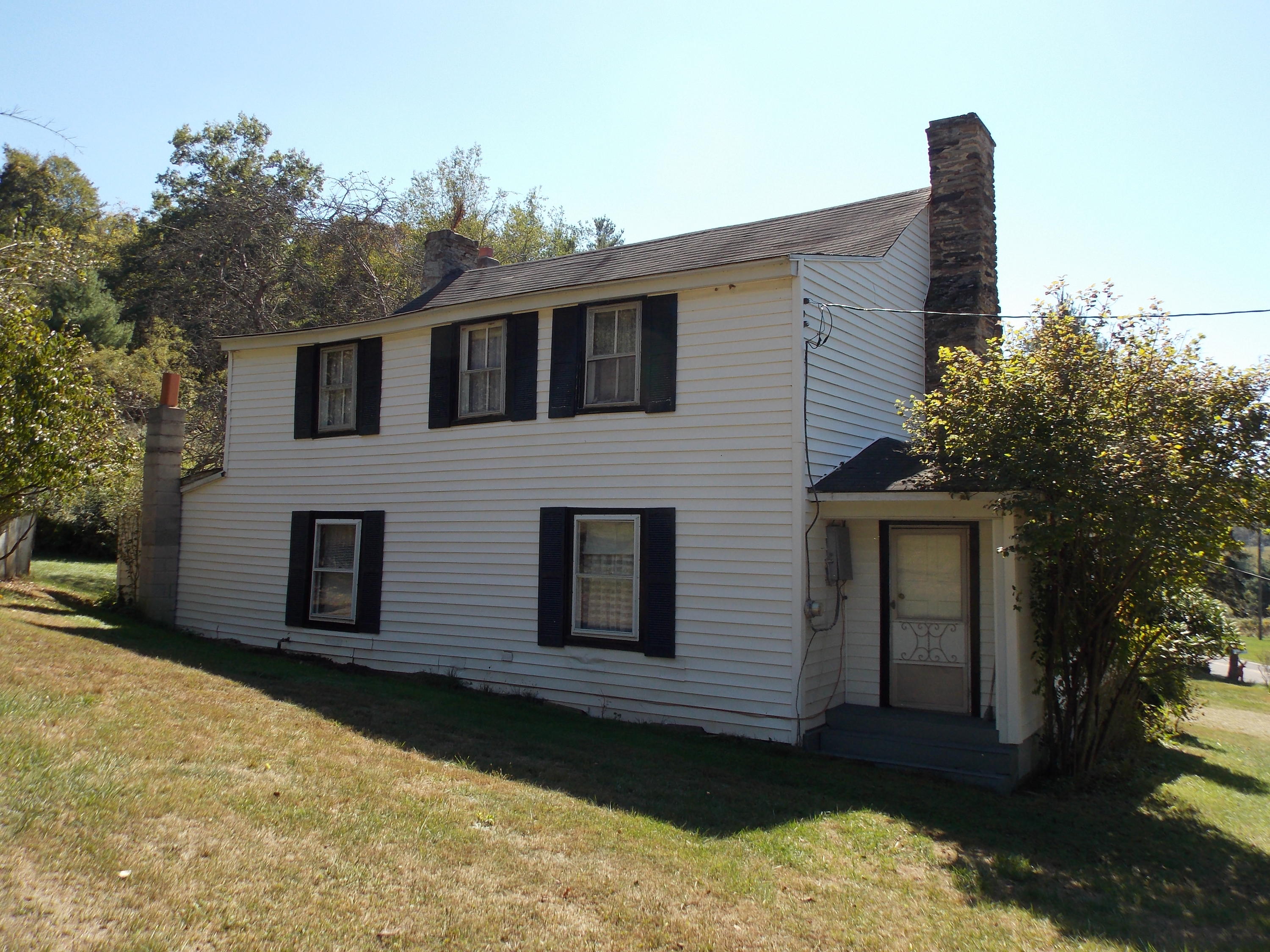 1087 Conner Grove Road Southwest Willis, VA 24380 - Photo 5 of 28 a front view of a house with a yard