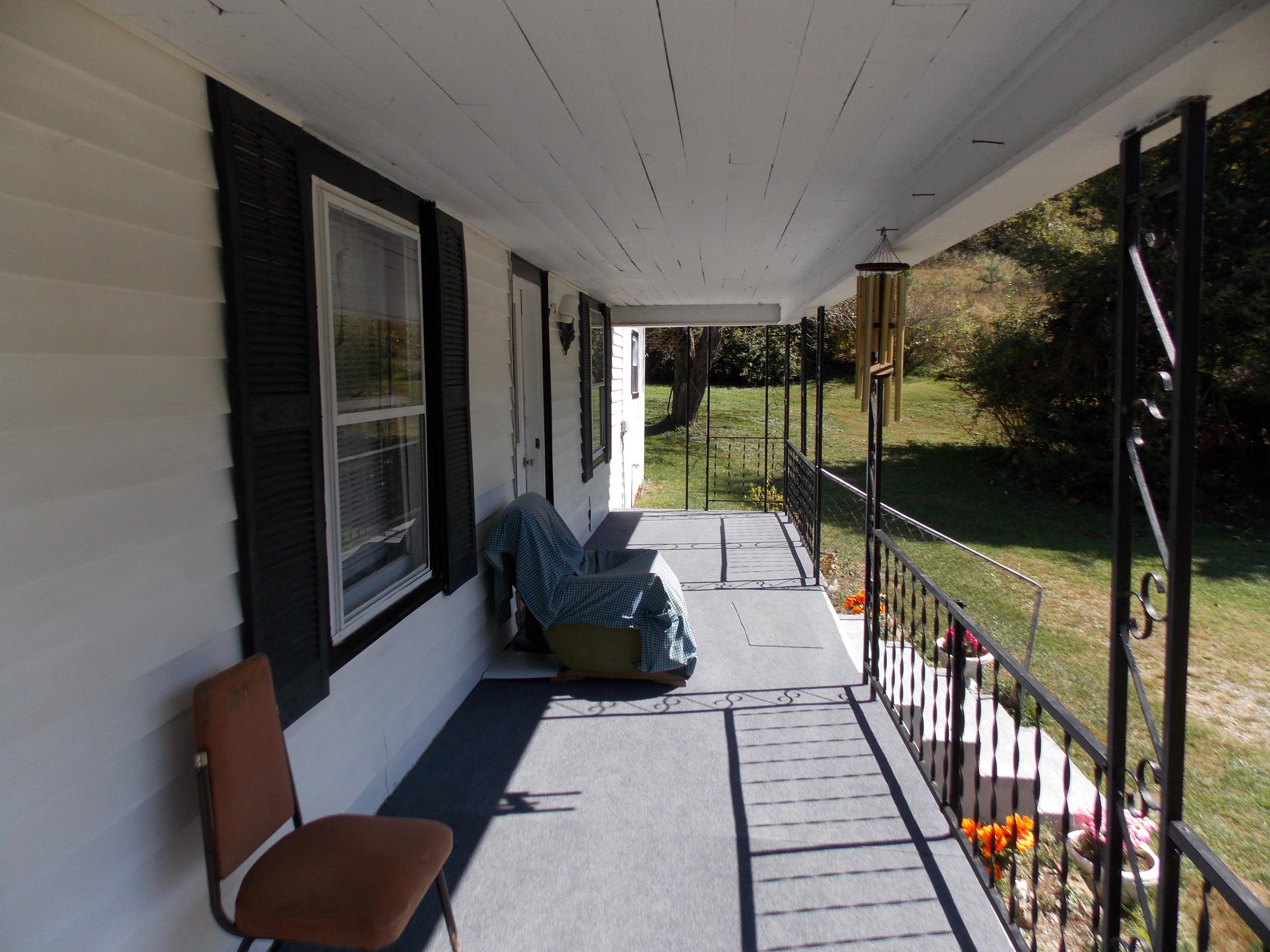 1087 Conner Grove Road Southwest Willis, VA 24380 - Photo 9 of 28 a balcony with chairs