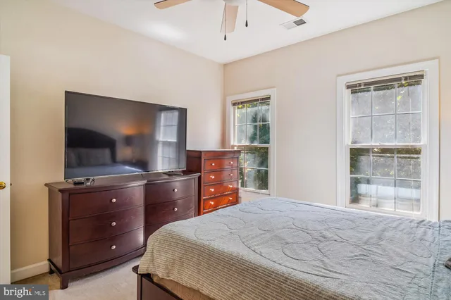a balcony with furniture and a potted plant