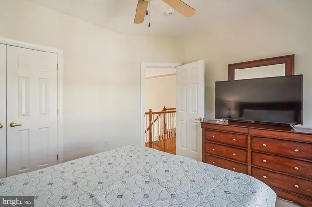 a outdoor space with patio the couches and a dining table and chairs with potted plants
