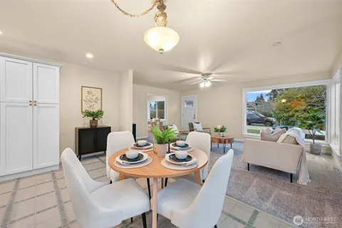 a view of a dining room with furniture window and outside view