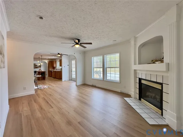 a view of a kitchen with cabinets and wooden floor