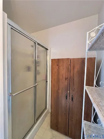 a large kitchen with a table and chairs in it