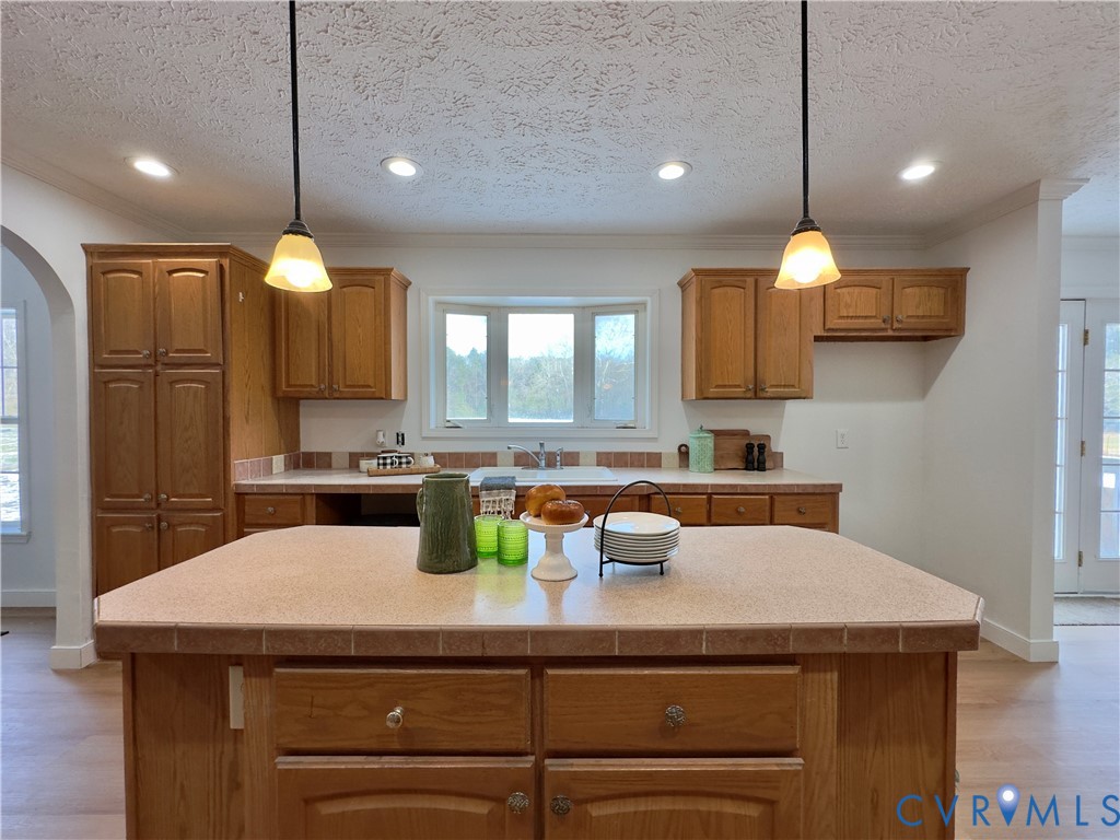 275 Reams Road Petersburg, VA 23805 - Photo 7 of 50 a kitchen with a sink a counter space cabinets and appliances