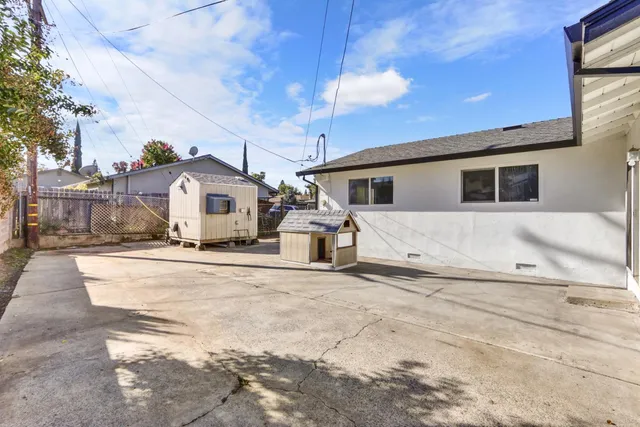a view of a house with snow on the road