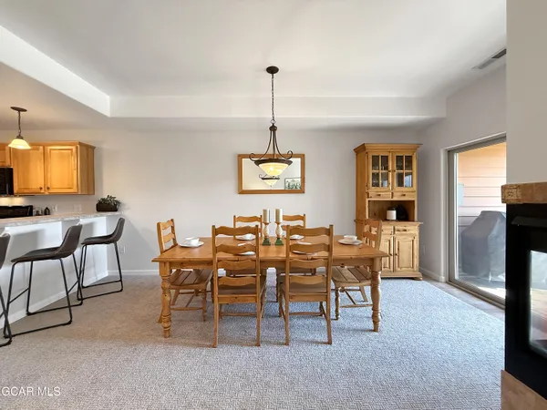 a dining room with furniture and window