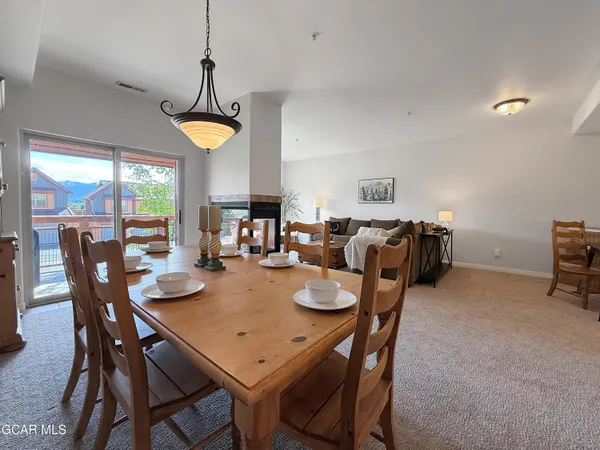 a view of a dining room with furniture window and outside view