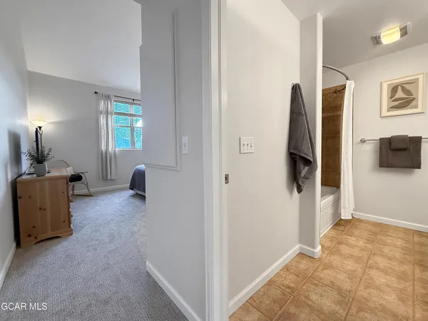 a view of a livingroom with furniture and a flat screen tv