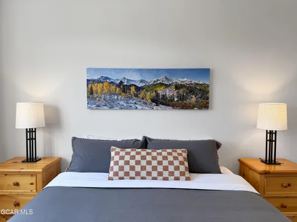 a living room with furniture and a lamp