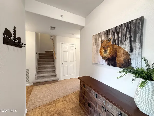 a view of a entryway with furniture and stairs