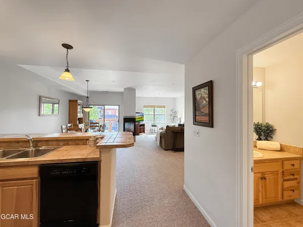 a kitchen with sink and cabinets