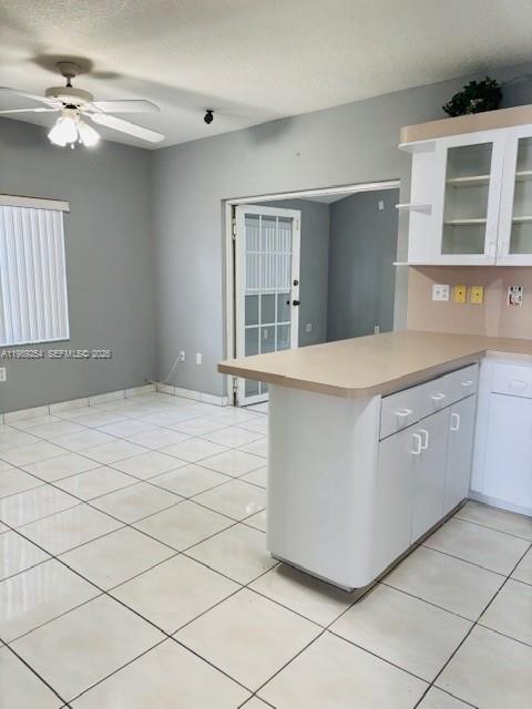 4621 Southwest 99th Court Miami, FL 33165 - Photo 4 of 10 a room with a cabinets and chandelier
