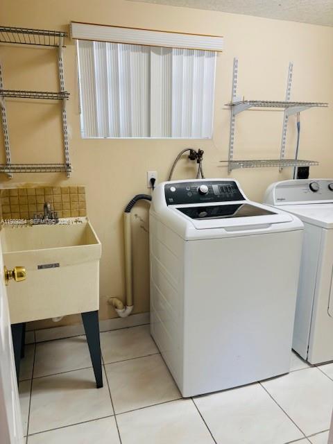 4621 Southwest 99th Court Miami, FL 33165 - Photo 7 of 10 a utility room with dryer and washer