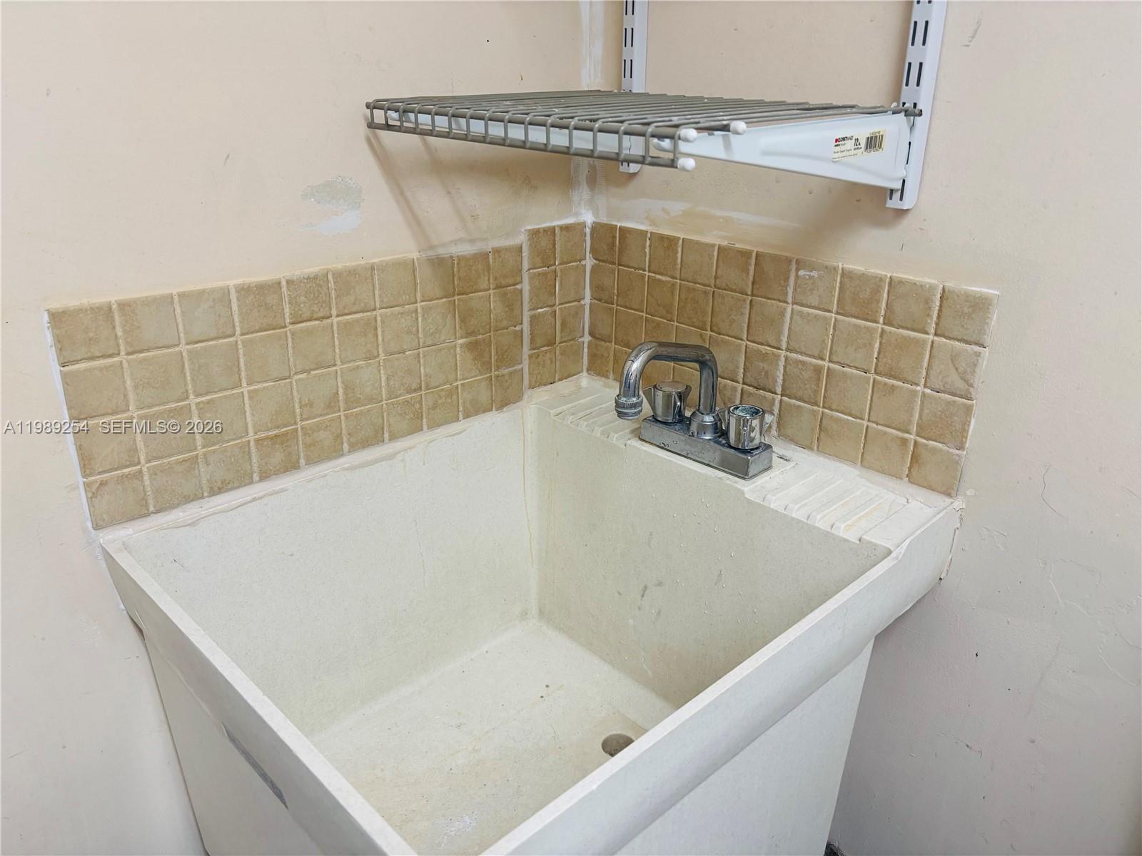 4621 Southwest 99th Court Miami, FL 33165 - Photo 8 of 10 a bathroom with a tub