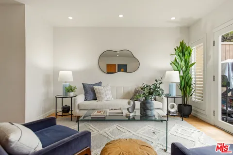 a view of room with furniture and wooden floor