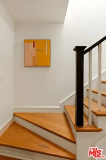 a room with a bed and mirror