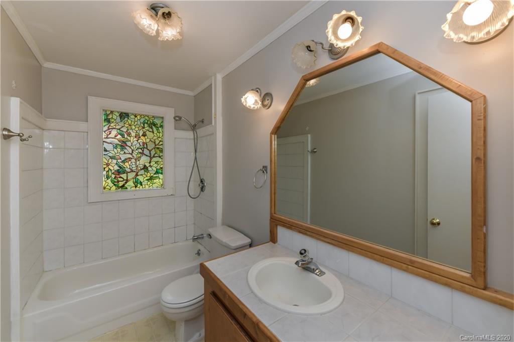 2255 Falmouth Road Charlotte, NC 28205 - Photo 11 of 28 a bathroom with a sink a toilet and shower