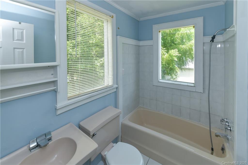 2255 Falmouth Road Charlotte, NC 28205 - Photo 19 of 28 a bathroom with a sink toilet and bathtub