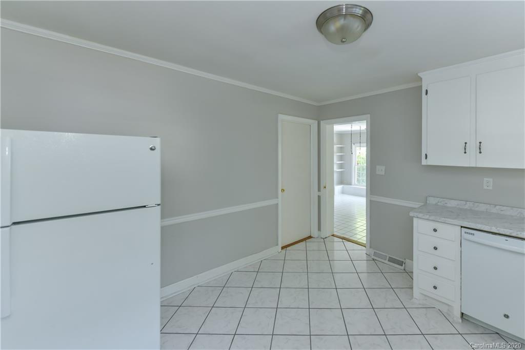 2255 Falmouth Road Charlotte, NC 28205 - Photo 21 of 28 a view of kitchen with white cabinets