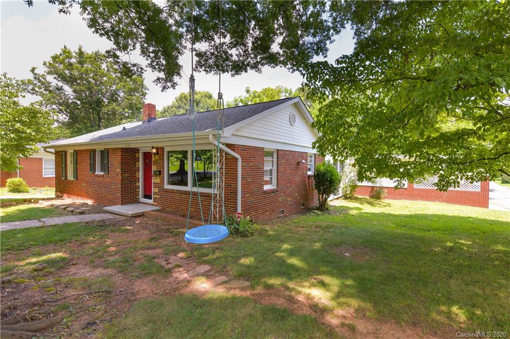 2255 Falmouth Road Charlotte, NC 28205 - Photo 5 of 28 a view of a house with a backyard and a tree