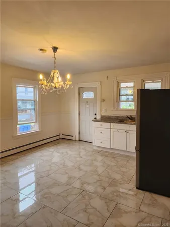 a view of a kitchen with granite countertop cabinets and a stainless steel appliances