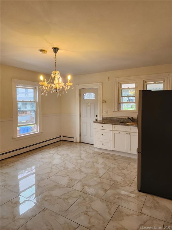 a view of a kitchen with granite countertop cabinets and a stainless steel appliances