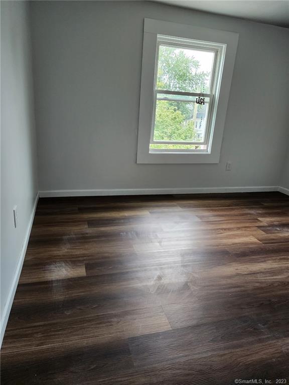 53 Cliff Street Shelton, CT 06484 - Photo 11 of 13 a view of an empty room with wooden floor and a window