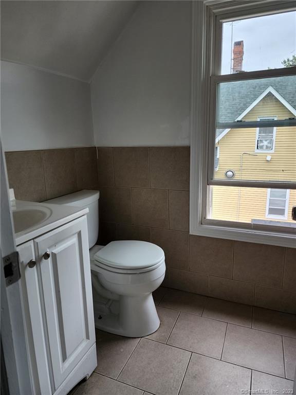 53 Cliff Street Shelton, CT 06484 - Photo 12 of 13 a bathroom with a toilet a sink and a window