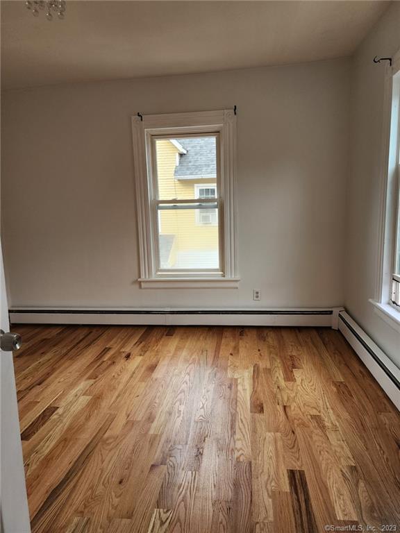53 Cliff Street Shelton, CT 06484 - Photo 4 of 13 a view of a room with wooden floor and window