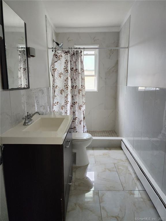 53 Cliff Street Shelton, CT 06484 - Photo 5 of 13 a bathroom with a sink a toilet and shower
