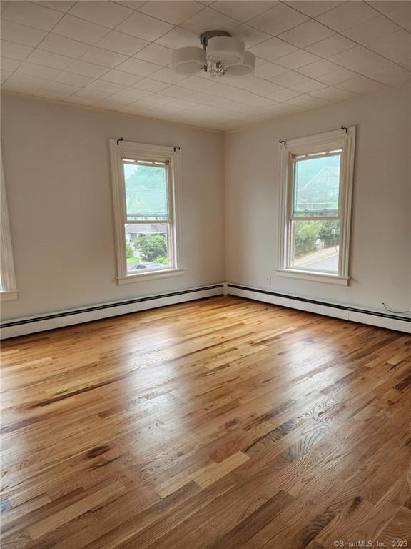 53 Cliff Street Shelton, CT 06484 - Photo 9 of 13 a view of an empty room with wooden floor and a window