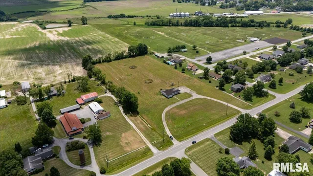 an aerial view of a house with a lake view