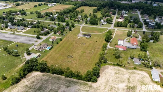 an aerial view of a house with a swimming pool