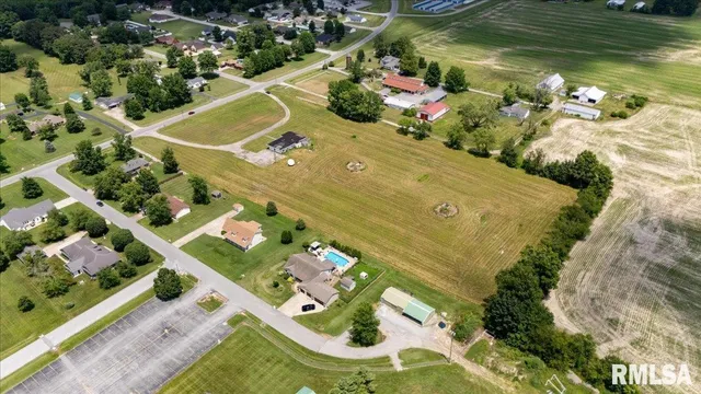 an aerial view of a house with a swimming pool